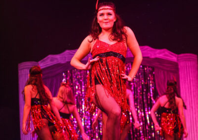 girl dancing in front with others