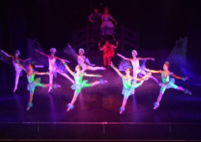girls dancing in green attire
